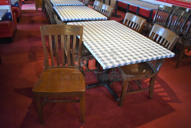 Table w/ Table Cloth on Black Metal Table Base and 4 Wooden Dining Chairs. Stock Picture - Cosmetic Condition May Vary. 48x48x30, 18x16x36. (Dining Room) - Image 1 of 5