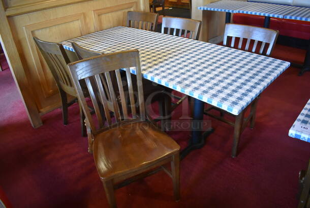 Table w/ Table Cloth on Black Metal Table Base and 6 Wooden Dining Chairs. Stock Picture - Cosmetic Condition May Vary. 30x72x28, 18x16x36. (Dining Room)