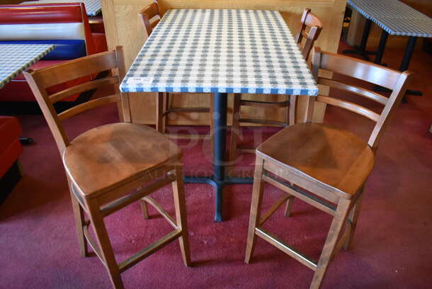 Bar Height Table w/ Table Cloth on Black Metal Table Base and 4 Wooden Bar Height Chairs. Stock Picture - Cosmetic Condition May Vary. 30x48x41, 17x16x44. (Dining Room)

 - Image 1 of 5