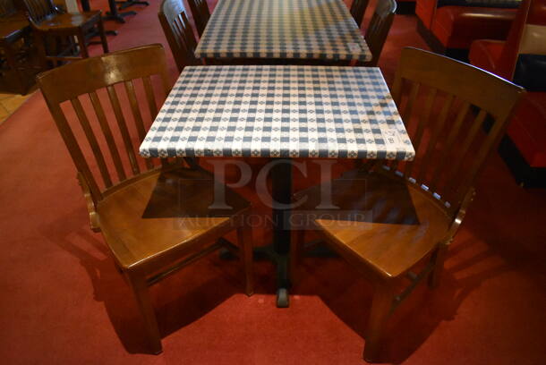 Table w/ Table Cloth on Black Metal Table Base and 2 Wooden Dining Chairs. Stock Picture - Cosmetic Condition May Vary. 24x30x30, 18x16x36. (Dining Room)