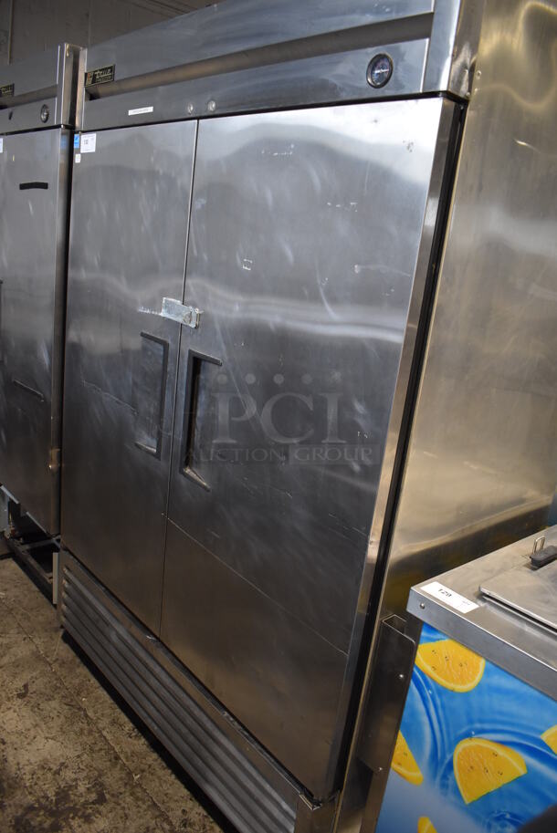 2011 True T-49F ENERGY STAR Stainless Steel Commercial 2 Door Reach In Freezer w/ Poly Coated Racks on Commercial Casters. 115 Volts, 1 Phase. 54x30x83. Tested and Powers On But Does Not Get Cold