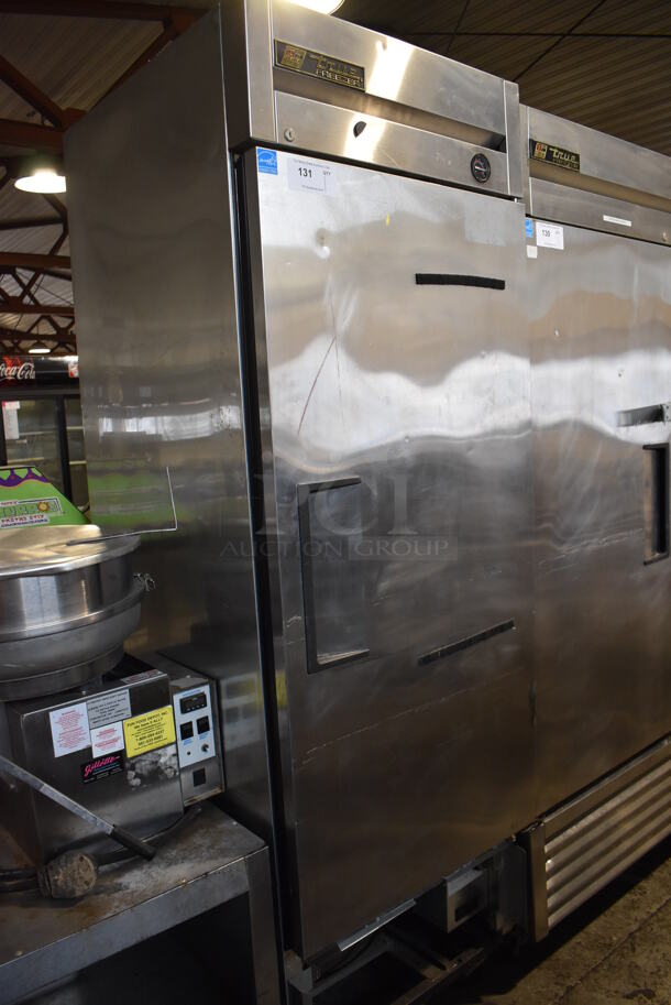 2013 True T-23F ENERGY STAR Stainless Steel Commercial Single Door Reach In Freezer w/ Poly Coated Racks on Commercial Casters. 115 Volts, 1 Phase. 27x30x83. Tested and Powers On But Does Not Get Cold