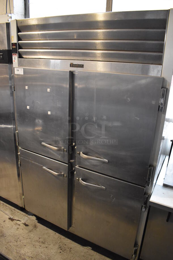 Traulsen G200000 ENERGY STAR Stainless Steel Commercial 4 Half Size Door Reach In Cooler on Commercial Casters. 115 Volts, 1 Phase. 52x36x83. Tested and Powers On But Does Not Get Cold
