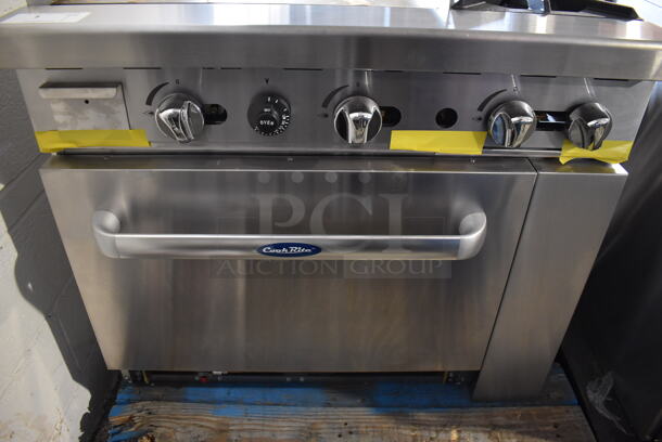 BRAND NEW! Cook Rite ATO-24G2B Stainless Steel Commercial Natural Gas Powered Flat Top Griddle w/ 2 Burner Range, Oven, Back Splash and Over Shelf. Stock Picture Used For Gallery Picture. 36x31x31 - Image 9 of 10