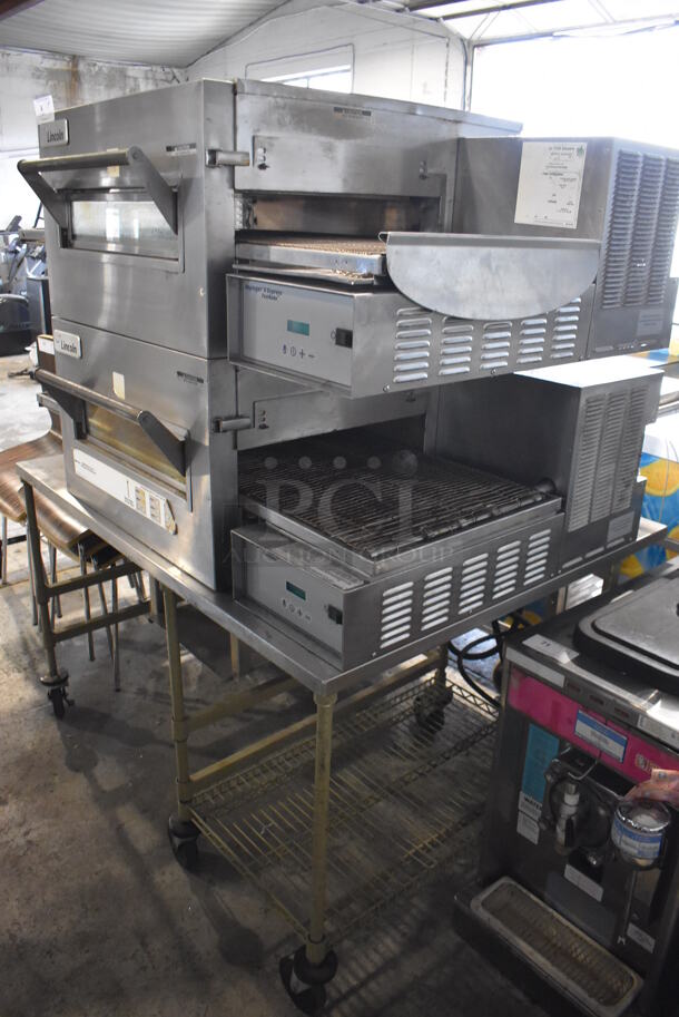 2 2014 Lincoln Impinger 1132-008-U-KF004 Stainless Steel Commercial Electric Powered Conveyor Pizza Oven on Stainless Steel Table w/ Commercial Casters. 208 Volts, 3 Phase. 55x44x69. 2 Times Your Bid! - Image 9 of 10