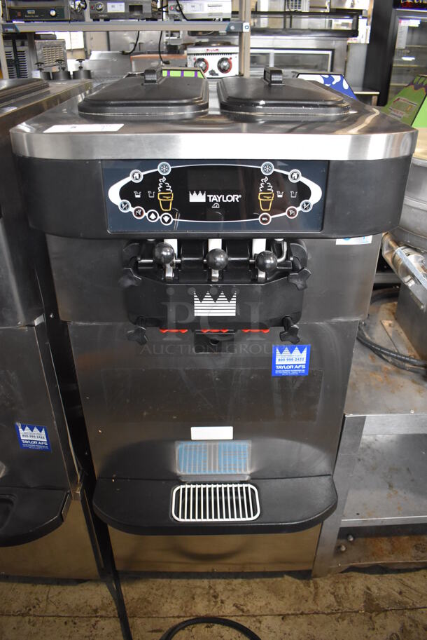 2012 Taylor C723-33 Stainless Steel Commercial Floor Style Water Cooled 2 Flavor Soft Serve Ice Cream Machine on Commercial Casters. 208-230 Volts, 3 Phase. 23x35x56