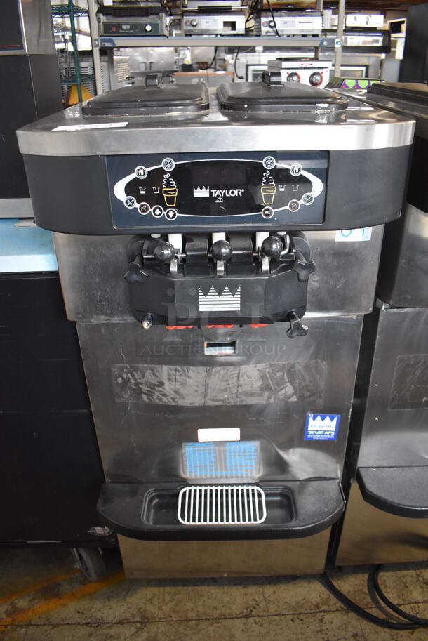 2012 Taylor C723-33 Stainless Steel Commercial Floor Style Water Cooled 2 Flavor Soft Serve Ice Cream Machine on Commercial Casters. 208-230 Volts, 3 Phase. 23x35x56