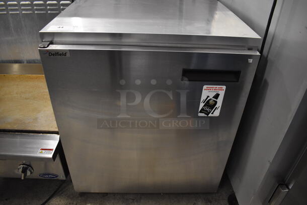 2016 Delfield 406CA-DHL-DD1 Stainless Steel Commercial Single Door Undercounter Cooler on Commercial Casters. 115 Volts, 1 Phase. 27x28x32. Tested and Powers On But Does Not Get Cold