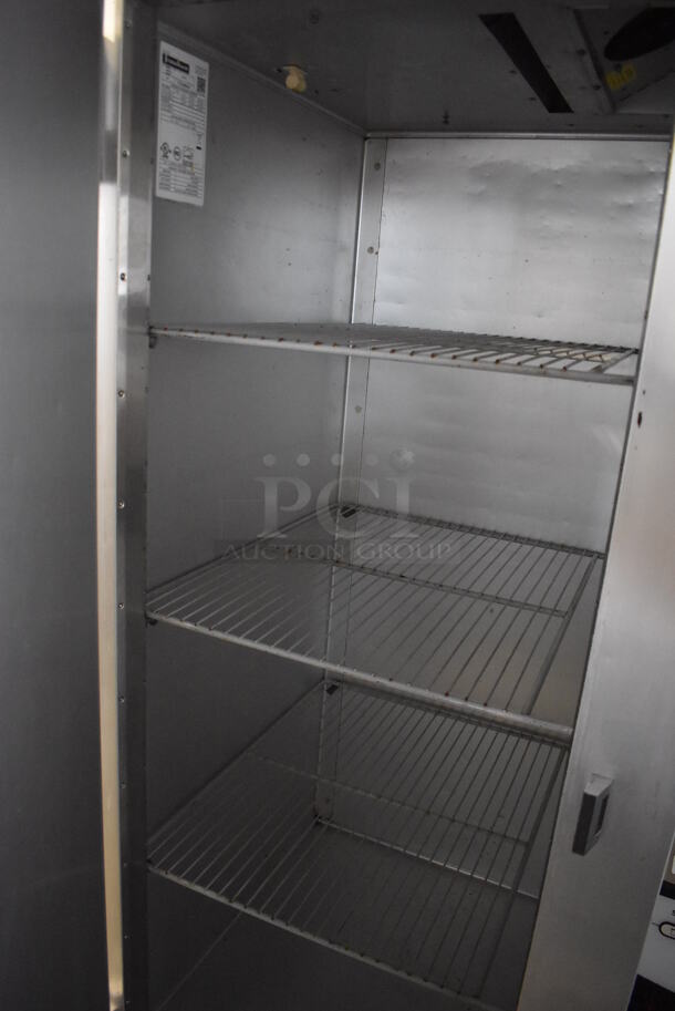 Traulsen G10011 Stainless Steel Commercial Single Door Reach In Cooler w/ Poly Coated Racks on Commercial Casters. 115 Volts, 1 Phase. 30x34x83. Tested and Working! - Image 2 of 6