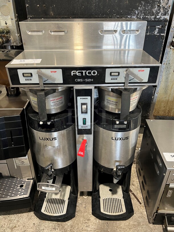 Fetco CBS-52H15 Stainless Steel Commercial Countertop Dual Coffee Machine w/ Hot Water Dispenser and 2 Metal Brew Baskets and 2 Servers. 120/208-240 Volts, 1 Phase. 21x17x37