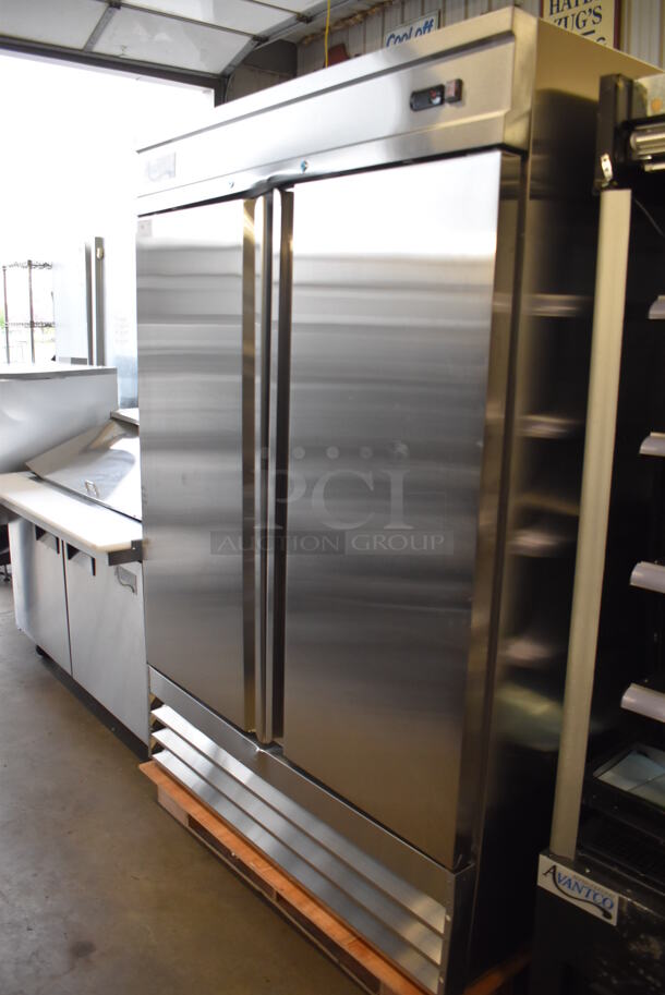 BRAND NEW SCRATCH AND DENT! Avantco 178SS2RHC Stainless Steel Commercial 2 Door Reach In Cooler w/ Poly Coated Racks. 115 Volts, 1 Phase. Tested and Working!