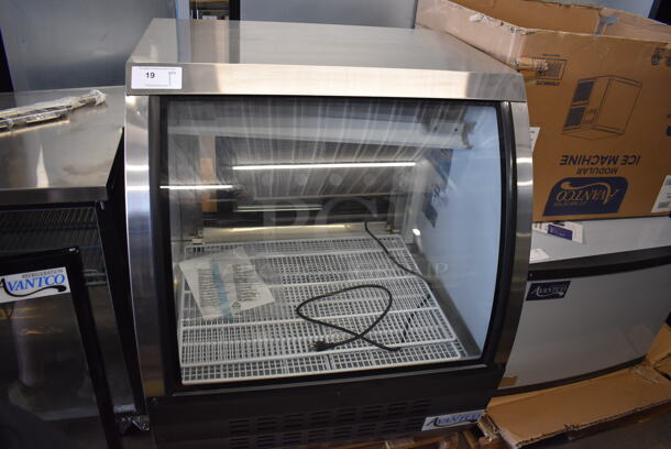 BRAND NEW SCRATCH AND DENT! Avantco 178DLC36HCB Black Metal Commercial Floor Style Curved Glass Refrigerated Deli Case Merchandiser. 115 Volts, 1 Phase. Tested and Powers On But Does Not Get Cold