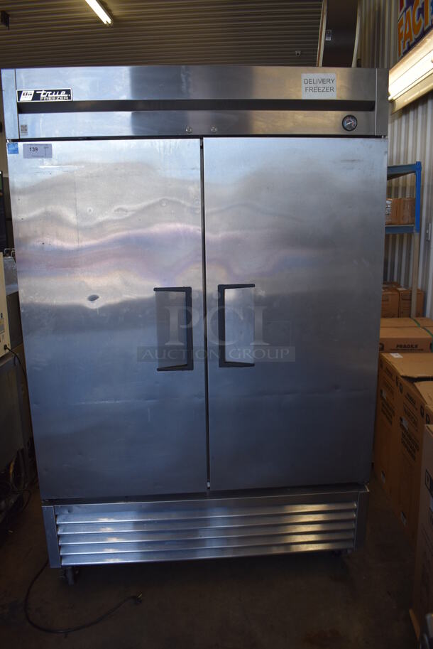 2013 True T-49F ENERGY STAR Stainless Steel Commercial 2 Door Reach In Freezer w/ Poly Coated Racks on Commercial Casters. 115 Volts, 1 Phase. Tested and Working!