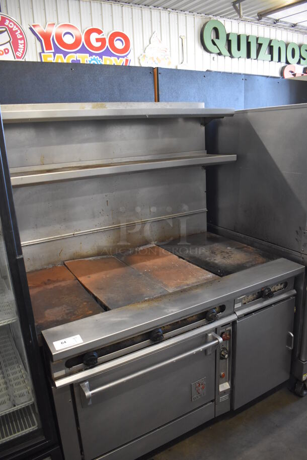 Wolf Stainless Steel Commercial Gas Powered Flat Top Griddle w/ Oven, 2 Over Shelves and Back Splash on Commercial Casters. 