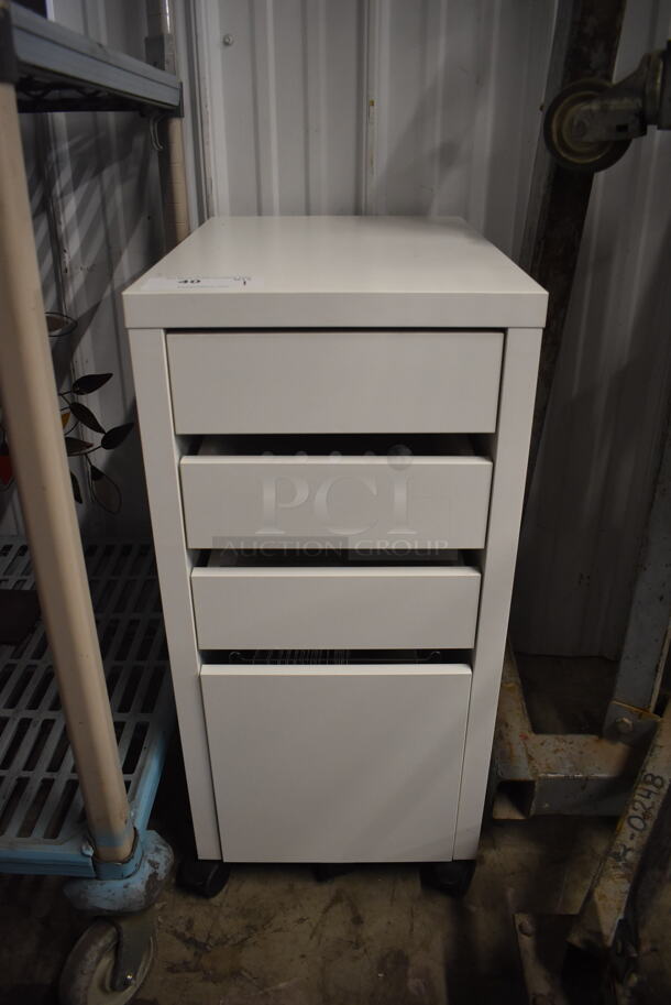 White Cabinet With 4 Pull Out Drawers On Commercial Casters. 