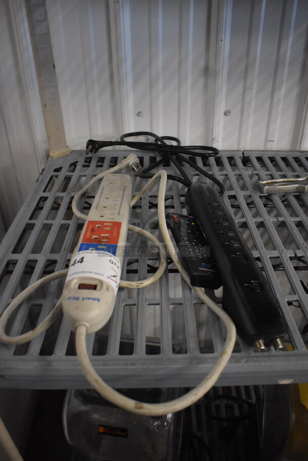 ALL ONE MONEY! Lot of 2 Outlet Power Strips and 1 Black Remote.  - Image 1 of 2