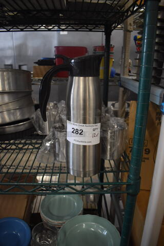 ALL ONE MONEY! Lot of 12 Items Including One Stainless Steel Carafe Server With Black Top and Handle And Stainless Steel Cups With Handles. 