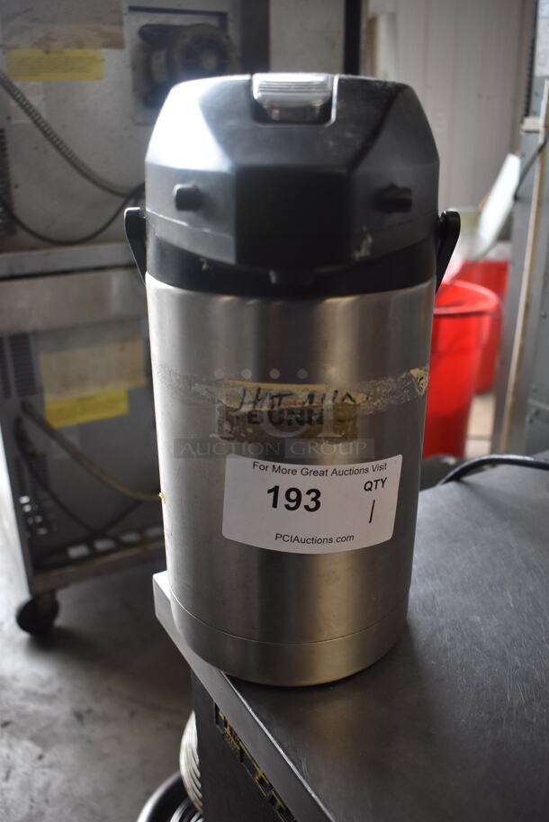 Stainless Steel Airpot Beverage Dispenser With Black Top and Handle. 