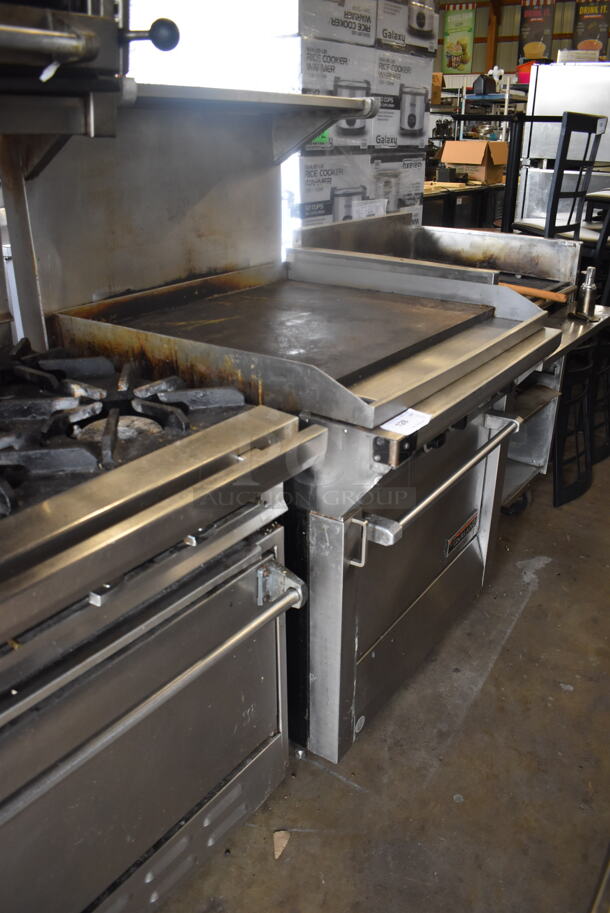Garland Natural Gas Powered Commercial Stainless Steel Oven With Steel Racks And Top Griddle With Overshelf On Galvanized Legs.  - Image 2 of 7