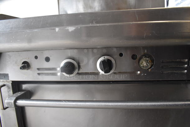 Garland Natural Gas Powered Commercial Stainless Steel Oven With Steel Racks And Top Griddle With Overshelf On Galvanized Legs.  - Image 6 of 7