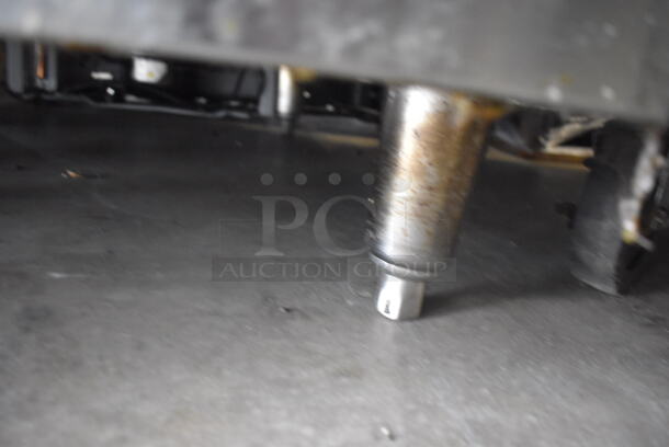 Garland Natural Gas Powered Commercial Stainless Steel Oven With Steel Racks And Top Griddle With Overshelf On Galvanized Legs.  - Image 7 of 7