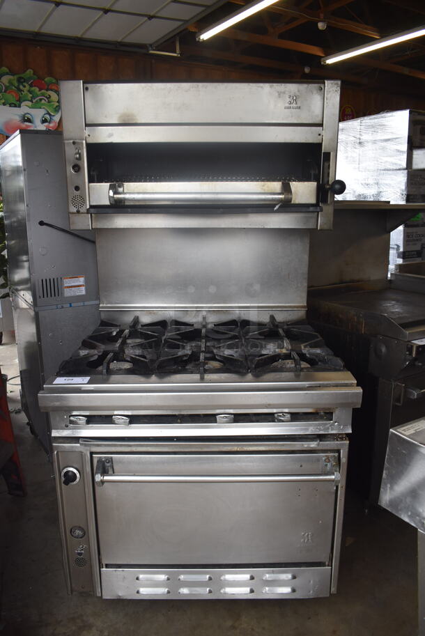 Jade Range Commercial Stainless Steel Natural Gas Powered Oven With 6 Gas Burners And Salamander Broiler and Salamander Shelves On Commercial Casters. 