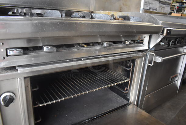 Jade Range Commercial Stainless Steel Natural Gas Powered Oven With 6 Gas Burners And Salamander Broiler and Salamander Shelves On Commercial Casters.  - Image 7 of 9