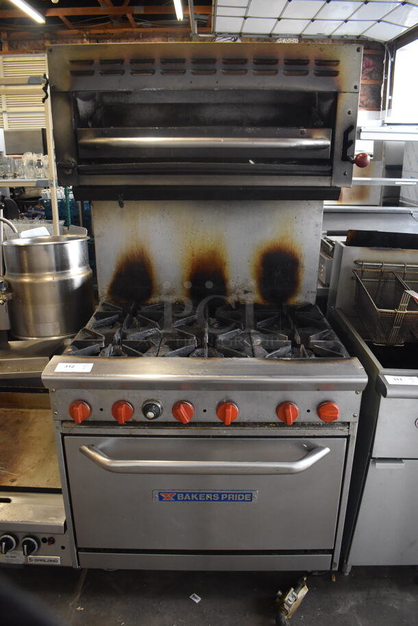Bakers Pride Commercial Stainless Steel 6 Burner Natural Gas Powered Range With Standard Oven With  Steel Racks and Salamander Broiler On Commercial Casters.  - Image 1 of 8