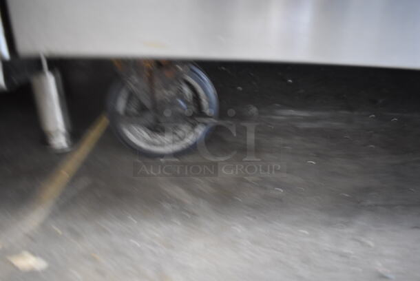 Bakers Pride Commercial Stainless Steel 6 Burner Natural Gas Powered Range With Standard Oven With  Steel Racks and Salamander Broiler On Commercial Casters.  - Image 8 of 8