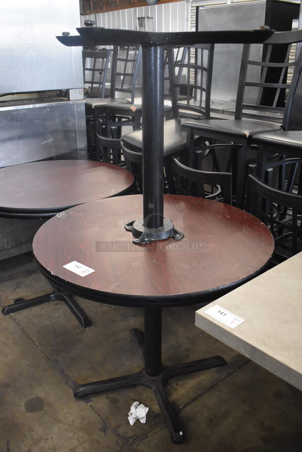 Circular Cafe Tables On 4 Prong Base. 1 Faux Wood Top and One Black Top. 2 Times Your Bid!  - Image 1 of 4