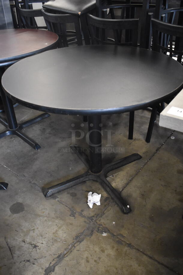 Circular Cafe Tables On 4 Prong Base. 1 Faux Wood Top and One Black Top. 2 Times Your Bid!  - Image 2 of 4