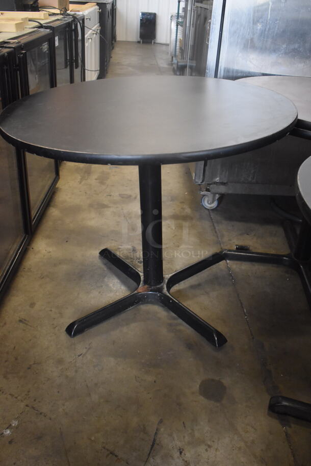 Circular Cafe Tables On 4 Prong Base. 1 Faux Wood Top and One Black Top. 2 Times Your Bid!  - Image 3 of 4