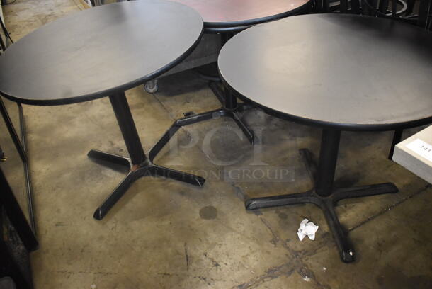 Circular Cafe Tables On 4 Prong Base. 1 Faux Wood Top and One Black Top. 2 Times Your Bid!  - Image 4 of 4