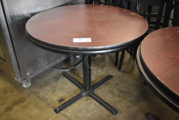 2 Circular Cafe Tables on 4 Prong Base. 1 Faux Wood And 1 Black Top Table. 2 Times Your Bid!  - Image 1 of 2