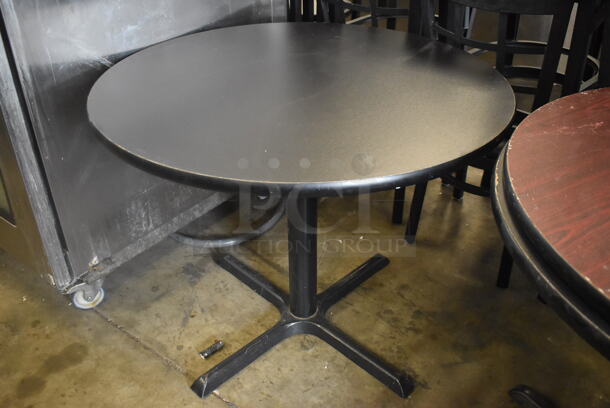 2 Circular Cafe Tables on 4 Prong Base. 1 Faux Wood And 1 Black Top Table. 2 Times Your Bid!  - Image 2 of 2
