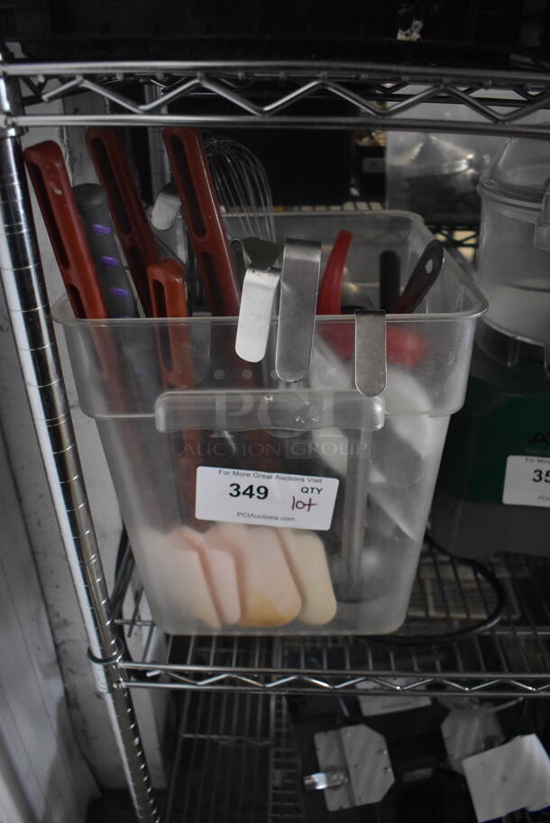 ALL ONE MONEY! Plastic Drop In Bin With Various Kitchen Utensils Including Spatulas, Whisk, Serving Spoons, and Measuring Cups - Image 1 of 2