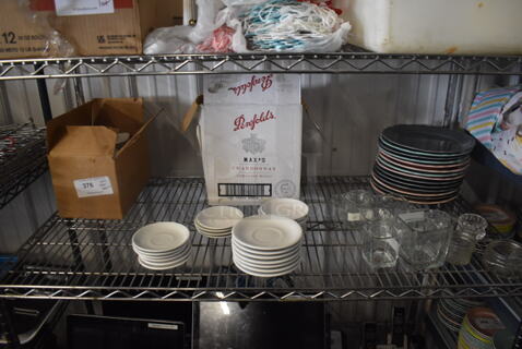 ALL ONE MONEY! Tier Lot of Various Items Including Saucers, Multi Colored Glass Plates, Glass Table Decorations, Box of White Colored Glass Plates, and Wooden Boards