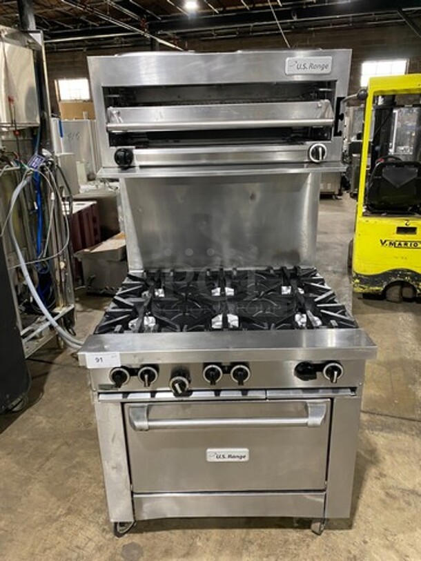 US Range Commercial Natural Gas Powered 6 Burner Stove! With Raised Back Splash And Salamander! With Oven Underneath! All Stainless Steel! On Casters!