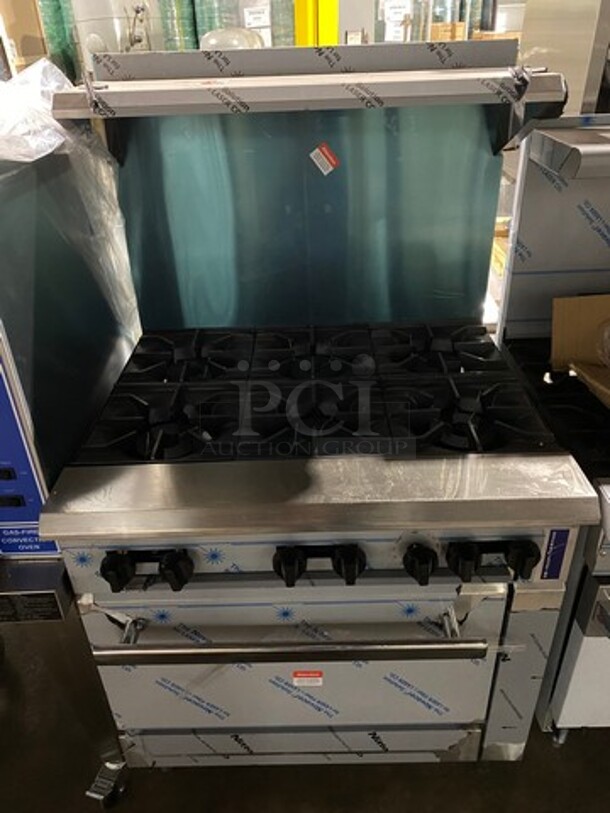 WOW! BRAND NEW! Rocket Commercial Natural Gas Powered 6 Burner Stove! With Raised Back Splash And Salamander Shelf! With Oven Underneath! All Stainless Steel! On Legs!