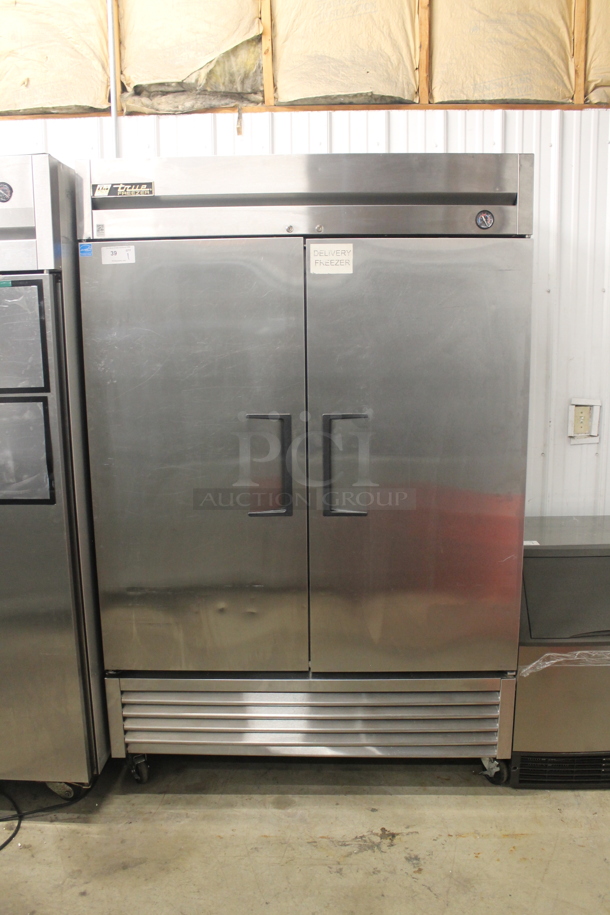 2013 True T-49F Commercial Stainless Steel 2 Door Reach In Freezer With Polycoated Shelves On Commercial Casters. 115V, 1 Phase. Tested and Working! - Image 1 of 6