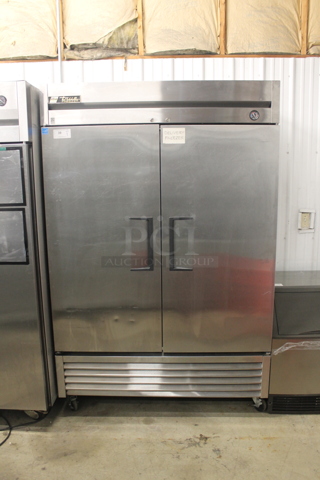 2013 True T-49F Commercial Stainless Steel 2 Door Reach In Freezer With Polycoated Shelves On Commercial Casters. 115V, 1 Phase. Tested and Working!