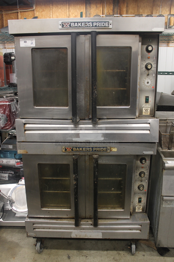 2 Bakers Pride Cyclone Series Commercial Stainless Steel Natural Gas Double Deck Full Size Convection Oven With Steel Racks And Baking Pans On Commercial Casters. 2 Times Your Bid!  - Image 1 of 10