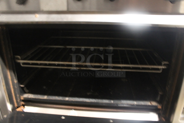 Vulcan Commercial Stainless Steel Natural Gas Powered 10 Burner Gas Range With Overshelf, 2 Ovens And Steel Racks. - Image 6 of 10