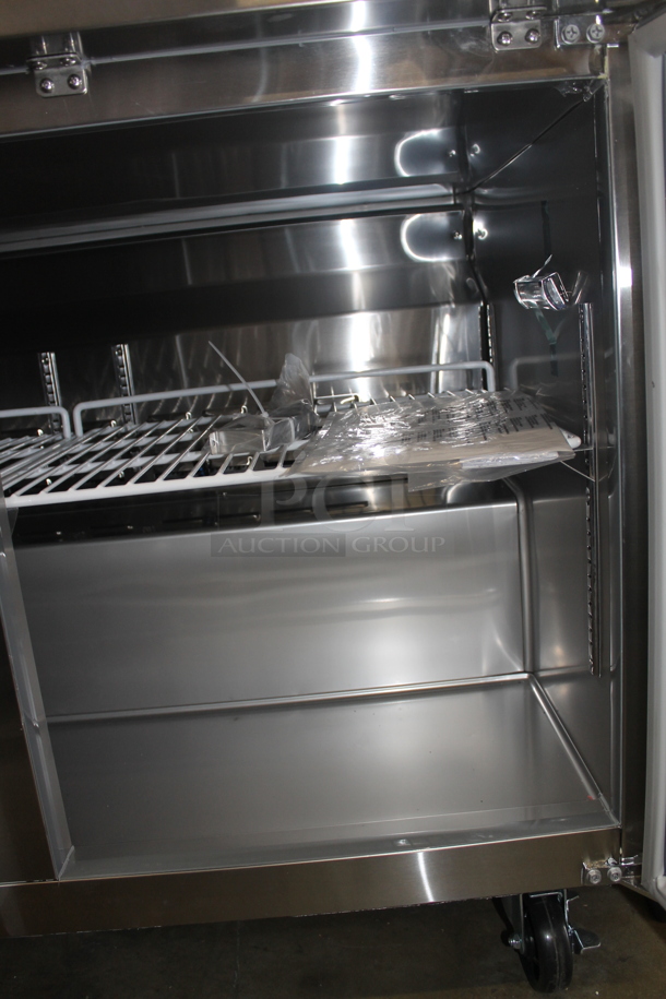 BRAND NEW SCRATCH AND DENT! Avantco 178SSWT48RHC Commercial Stainless Steel 2-Door Worktop Cooler With Backsplash And Polycoated Shelves On Commercial Casters. 115V. Tested and Powers On But Does Not Get Cold
 - Image 6 of 9