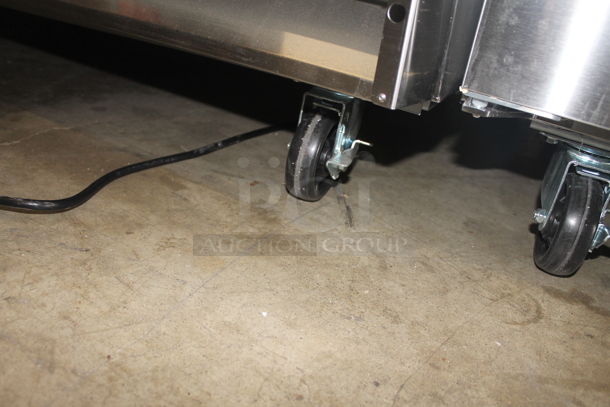 BRAND NEW SCRATCH AND DENT! Avantco 178SS2FHC Commercial Stainless Steel Two Door Reach-In Freezer On Commercial Casters. 115V. Tested and Working! - Image 10 of 11