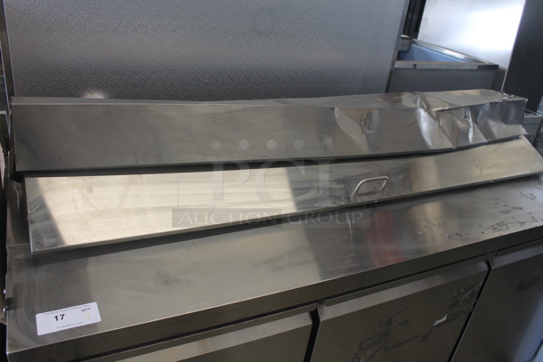 BRAND NEW SCRATCH AND DENT! Avantco 178APT71HC Commercial Stainless Steel 3-Door Refrigerated Sandwich/Salad Prep Table With Polycoated Shelves On Commercial Casters. 115V. Tested and Powers On But Does Not Get Cold - Image 4 of 12