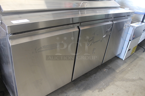 BRAND NEW SCRATCH AND DENT! Avantco 178APT71HC Commercial Stainless Steel 3-Door Refrigerated Sandwich/Salad Prep Table With Polycoated Shelves On Commercial Casters. 115V. Tested and Powers On But Does Not Get Cold - Image 5 of 12