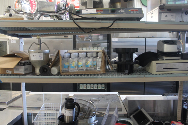 ALL ONE MONEY! Lot of Hand Sanitizer, Box Of Yellow Beverage Napkins, Knives, Cash Drawer, AND MORE! Does Not Include Metro Shelf. - Image 1 of 4