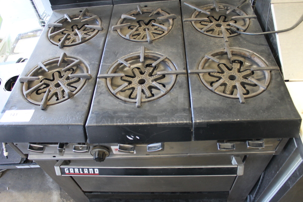 Garland Commercial Stainless Steel Natural Gas Powered Stove With 6 Burners, Backsplash And Oven With Steel Rack. - Image 2 of 8