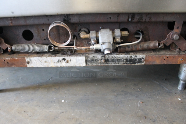 Garland Commercial Stainless Steel Natural Gas Powered Stove With 6 Burners, Backsplash And Oven With Steel Rack. - Image 6 of 8